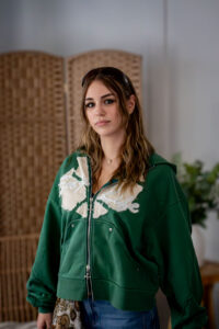 woman wearing a green enjoy life hoodie
